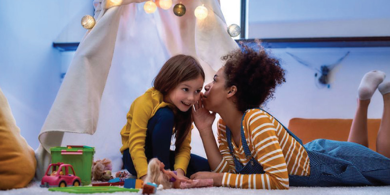 A photo of a nanny and a child.