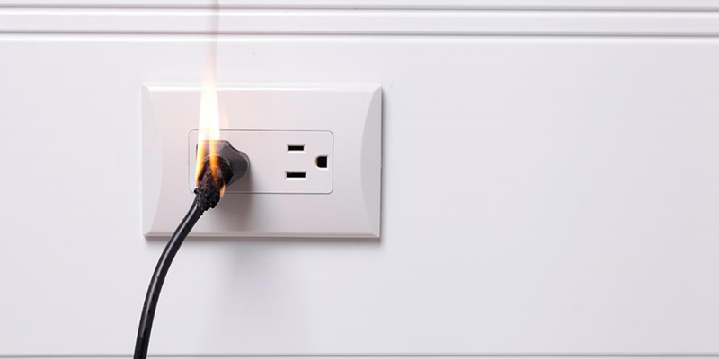 A photo of an outlet starting electrical fires.